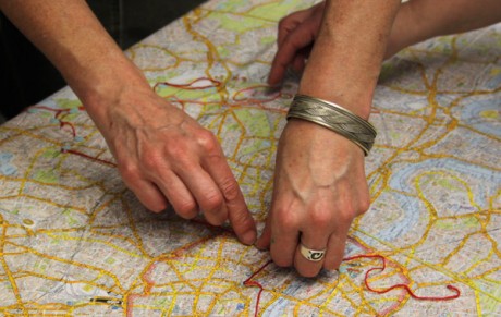 Hands over a map