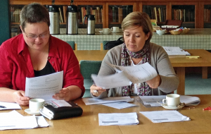 two females reviewing documents